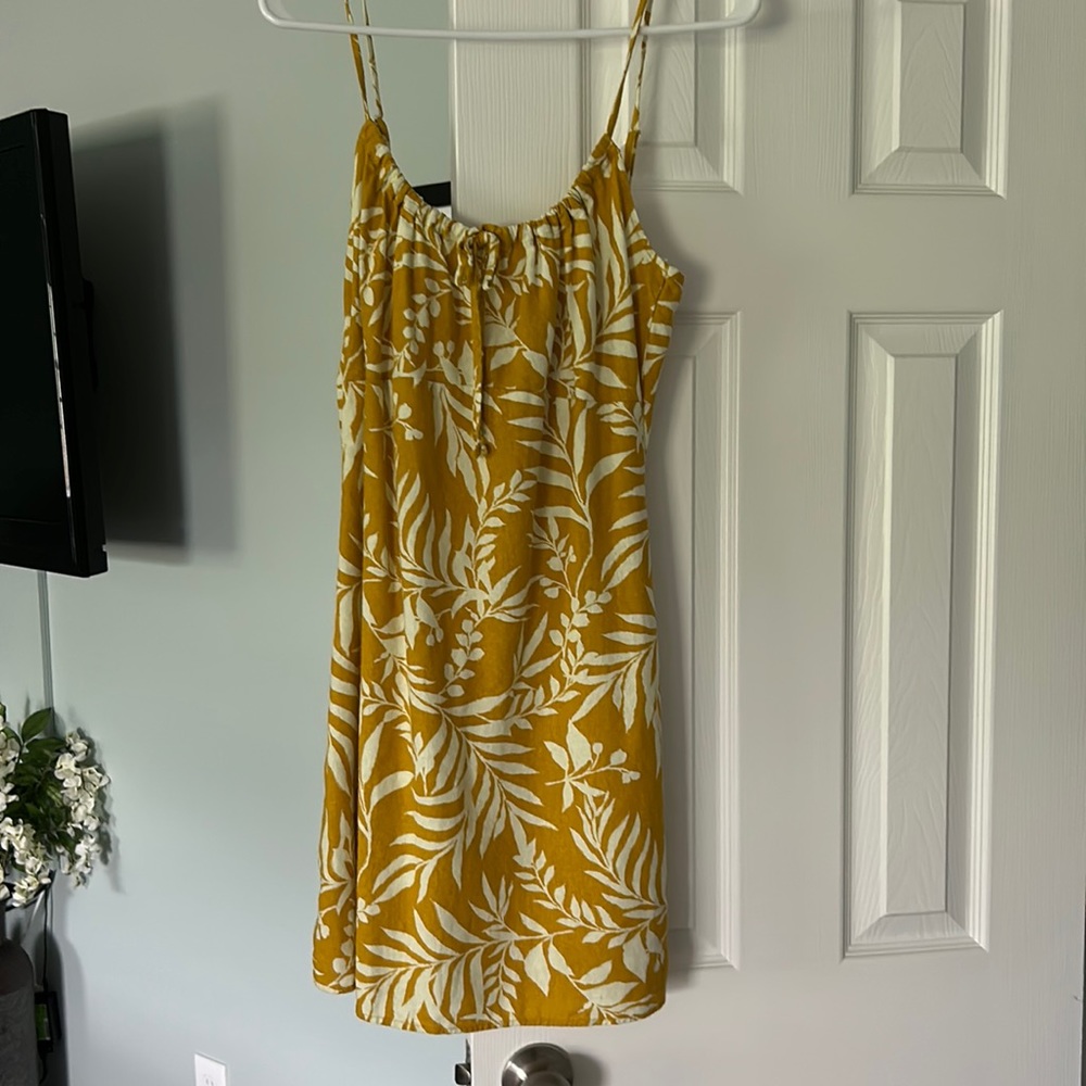 Orange/yellow spaghetti strap short bebop dress. Very cute for summertime